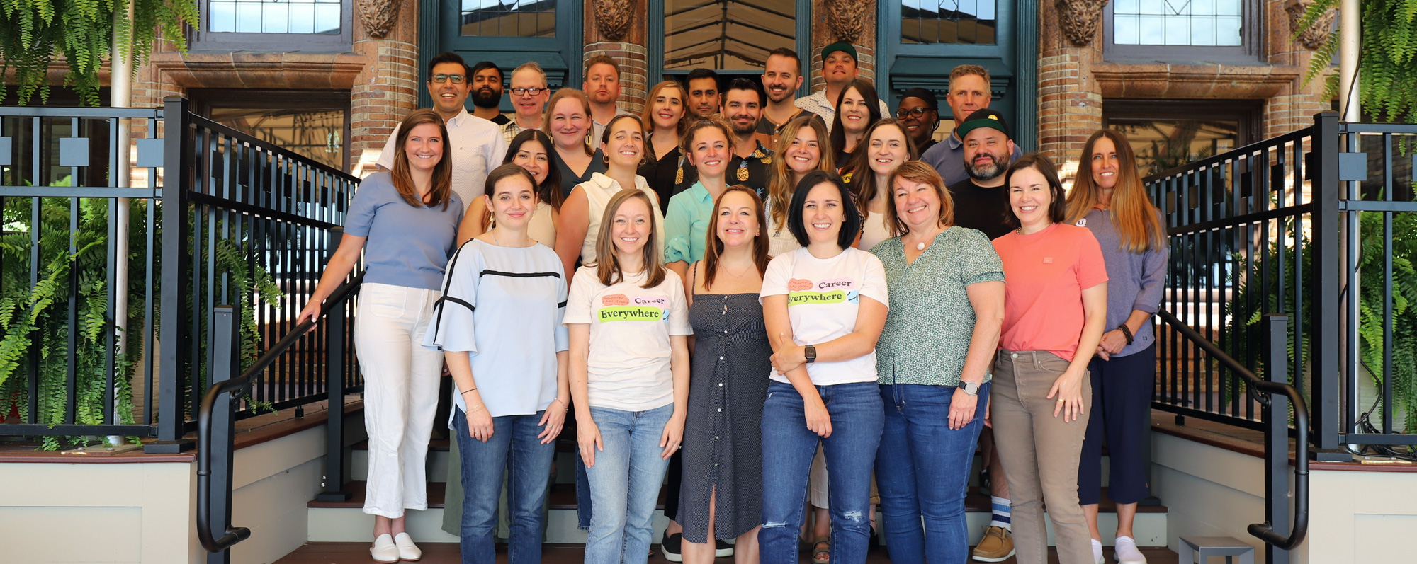 Group shot of the uConnect team standing outside on a staircase